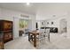 Casual dining area with wood table and sliding doors to patio at 3257 Carpentaria Dr, New Smyrna Beach, FL 32168