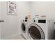 Bright laundry room features a washer and dryer, and ample storage at 3257 Carpentaria Dr, New Smyrna Beach, FL 32168