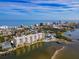 Aerial view of condo building, pool, and surrounding area near the beach at 3606 S Peninsula Dr # 809, Port Orange, FL 32127