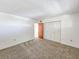 Well-lit bedroom featuring neutral walls and carpet at 3606 S Peninsula Dr # 809, Port Orange, FL 32127