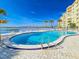 Inviting community pool with water views and lounge chairs at 3606 S Peninsula Dr # 809, Port Orange, FL 32127