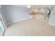 Open living room and kitchen with tile floors at 3641 S Atlantic Ave # 221, Daytona Beach, FL 32118