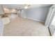 Bright living room with tile floors and kitchen access at 3641 S Atlantic Ave # 221, Daytona Beach, FL 32118