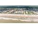 Expansive beachside view of a condo community featuring multiple buildings, pools, and beachfront access at 3700 S Atlantic Ave # 108, New Smyrna Beach, FL 32169