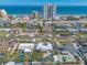 Aerial view of a home near the beach with a pool and circular driveway at 3862 Cardinal Blvd, Port Orange, FL 32127