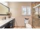 Bathroom boasts a large vanity, walk-in shower, and toilet at 3862 Cardinal Blvd, Port Orange, FL 32127