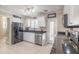 Bright kitchen featuring white cabinets, granite counters, and stainless steel appliances at 3862 Cardinal Blvd, Port Orange, FL 32127