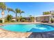 Relaxing kidney-shaped pool with patio and tropical landscaping at 3862 Cardinal Blvd, Port Orange, FL 32127