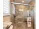 Large walk-in shower with tile surround and built-in shelving at 3862 Cardinal Blvd, Port Orange, FL 32127