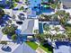 Gorgeous aerial view featuring a private pool, tropical foliage, and convenient street access at 402 Lincoln Ave, New Smyrna Beach, FL 32169