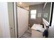 Modern bathroom with marble vanity and a large shower at 402 Lincoln Ave, New Smyrna Beach, FL 32169