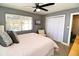 Bedroom with a queen bed, chair, and built in closet at 402 Lincoln Ave, New Smyrna Beach, FL 32169