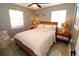 Cozy bedroom with a plush bed and ample natural light at 402 Lincoln Ave, New Smyrna Beach, FL 32169