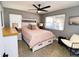 Bedroom with a queen bed, built in drawers and ceiling fan at 402 Lincoln Ave, New Smyrna Beach, FL 32169