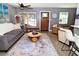 Living room with gray sofa and round coffee table at 402 Lincoln Ave, New Smyrna Beach, FL 32169