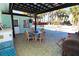 Outdoor patio with dining area and grill at 402 Lincoln Ave, New Smyrna Beach, FL 32169