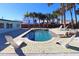 Relaxing pool area with modern lounge chairs at 402 Lincoln Ave, New Smyrna Beach, FL 32169