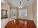 Open-concept dining room featuring hardwood floors and natural light at 454 Venetian Villa Dr, New Smyrna Beach, FL 32168