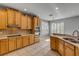 Contemporary kitchen featuring stainless steel appliances, tile flooring, and custom wood cabinetry at 454 Venetian Villa Dr, New Smyrna Beach, FL 32168