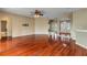 Open-concept living room with hardwood floors and neutral wall colors at 454 Venetian Villa Dr, New Smyrna Beach, FL 32168