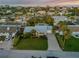 Aerial view of a single-Gathering home with a lush green lawn and ocean views at 4611 Doris Dr, New Smyrna Beach, FL 32169