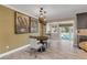 Breakfast nook with a round table and chairs, near the kitchen at 4611 Doris Dr, New Smyrna Beach, FL 32169