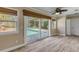 Gathering room with sliding glass doors to the pool area at 4611 Doris Dr, New Smyrna Beach, FL 32169