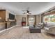 Bright living room featuring hardwood floors, fireplace, and comfortable seating at 4611 Doris Dr, New Smyrna Beach, FL 32169