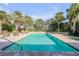 Inviting pool area with lounge chairs and tropical landscaping at 4611 Doris Dr, New Smyrna Beach, FL 32169