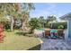 Resort-style pool with patio furniture and lush landscaping at 4611 Doris Dr, New Smyrna Beach, FL 32169