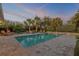 Tranquil pool area at dusk with fire pit and seating at 4611 Doris Dr, New Smyrna Beach, FL 32169