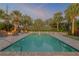 Inviting rectangular pool with surrounding patio and tropical landscaping at 4611 Doris Dr, New Smyrna Beach, FL 32169