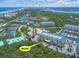 Aerial view of Harbour Village community, highlighting building #6204 near marina at 4623 Rivers Edge Village Ln # 6204, Ponce Inlet, FL 32127