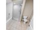 Bathroom with shower, toilet and tile flooring at 4623 Rivers Edge Village Ln # 6204, Ponce Inlet, FL 32127