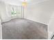 Spacious bedroom with large windows and neutral carpeting at 4623 Rivers Edge Village Ln # 6204, Ponce Inlet, FL 32127