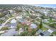 An elevated view of a lovely neighborhood by the beach, with mature trees and appealing residential architecture at 4650 Saxon Dr, New Smyrna Beach, FL 32169