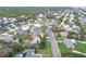 A serene aerial shot features a residential area set against a backdrop of lush vegetation and established trees at 4650 Saxon Dr, New Smyrna Beach, FL 32169