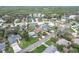 High-angle shot captures a charming residential area, highlighted by a beautiful landscape and mature trees at 4650 Saxon Dr, New Smyrna Beach, FL 32169