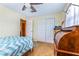 Cozy bedroom with ceiling fan, closet, and desk nook area at 4650 Saxon Dr, New Smyrna Beach, FL 32169