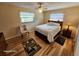 Bright bedroom with wood floors and ceiling fan at 4650 Saxon Dr, New Smyrna Beach, FL 32169