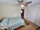 Small bedroom with wood floors and ceiling fan at 4650 Saxon Dr, New Smyrna Beach, FL 32169