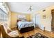 Bedroom with ceiling fan, hardwood floors and closet at 4650 Saxon Dr, New Smyrna Beach, FL 32169