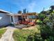 Backyard deck with pergola, ideal for outdoor dining at 4650 Saxon Dr, New Smyrna Beach, FL 32169