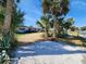 Attractive single-story home with a well-maintained front yard and palm trees at 4650 Saxon Dr, New Smyrna Beach, FL 32169