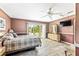 A spacious main bedroom featuring wood-look floors and direct access to the outdoor patio at 4650 Saxon Dr, New Smyrna Beach, FL 32169