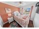 Cozy bedroom with hardwood floors and coral decor at 4773 S Atlantic Ave # 10, Ponce Inlet, FL 32127