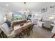 Dining room with wooden table and ocean view at 4773 S Atlantic Ave # 10, Ponce Inlet, FL 32127