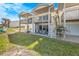 Two-story beach home with private patio, grassy area, and balcony at 4773 S Atlantic Ave # 10, Ponce Inlet, FL 32127