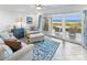 Bright living room with ocean view and comfy seating at 4773 S Atlantic Ave # 10, Ponce Inlet, FL 32127