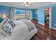 Main bedroom with ocean view, hardwood floors, and walk-in closet at 4773 S Atlantic Ave # 10, Ponce Inlet, FL 32127